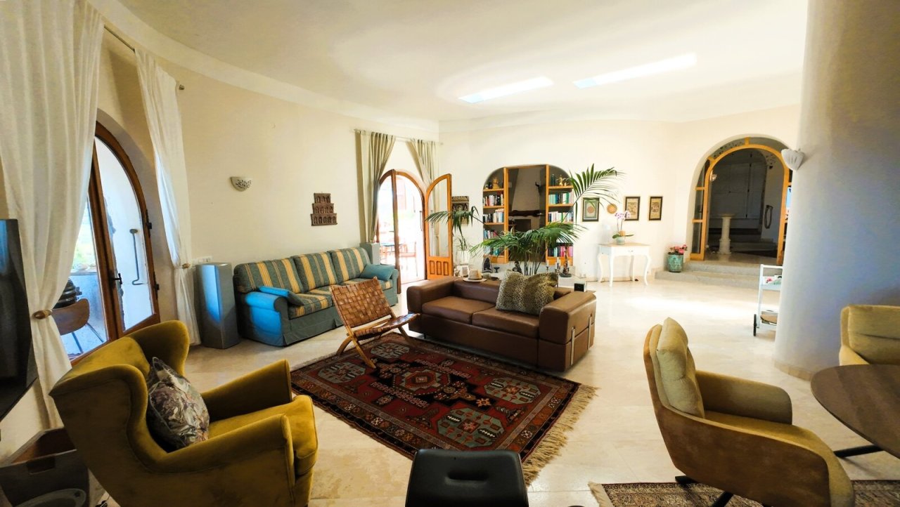 Bright living paradise with Mediterranean arch windows and harmonious layout