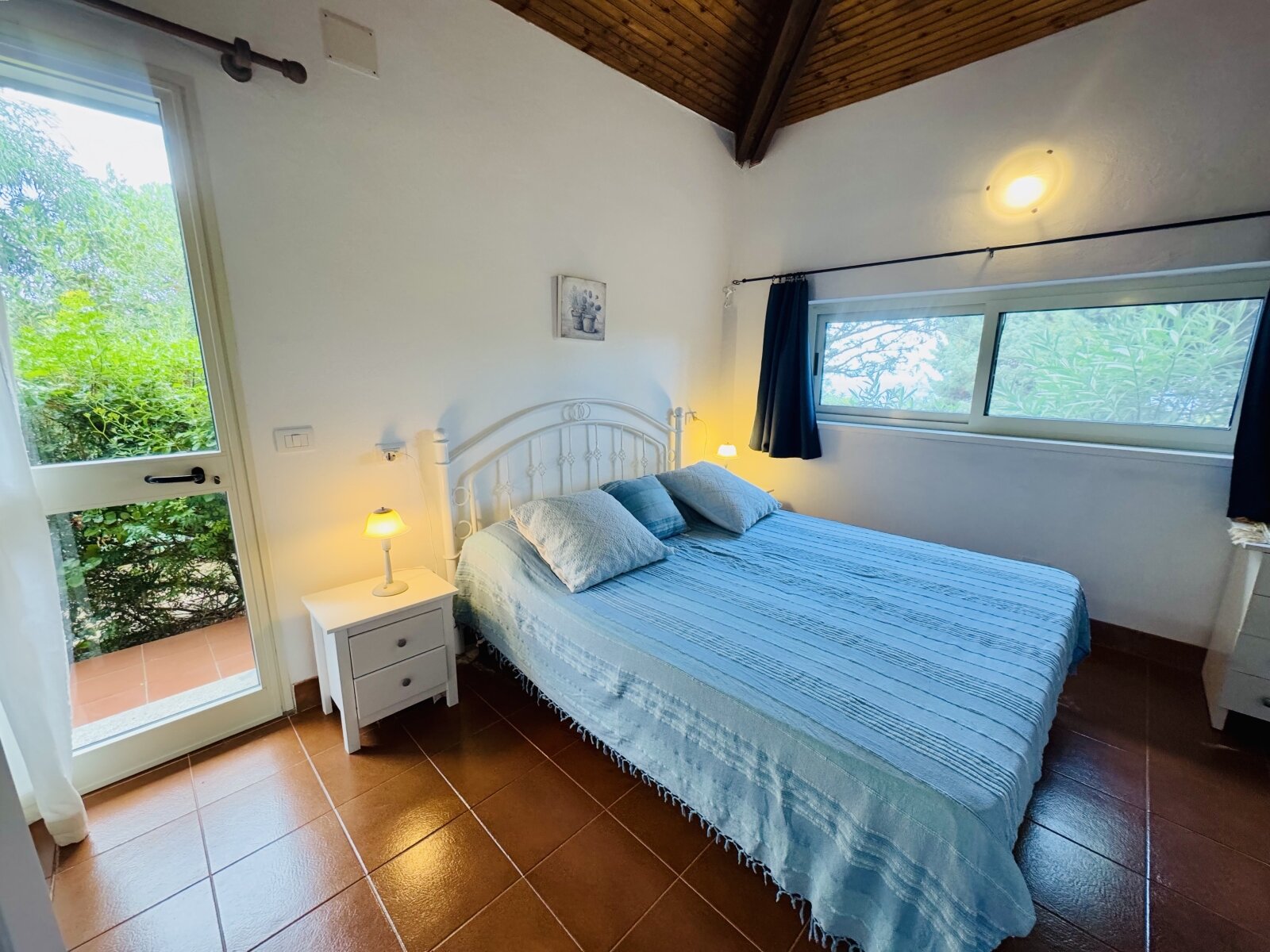 Brightly lit bedroom with panoramic nature view and cozy wooden ceiling - your retreat to relax! Brightly lit bedroom with panoramic nature view and cozy wooden ceiling - your retreat to relax!