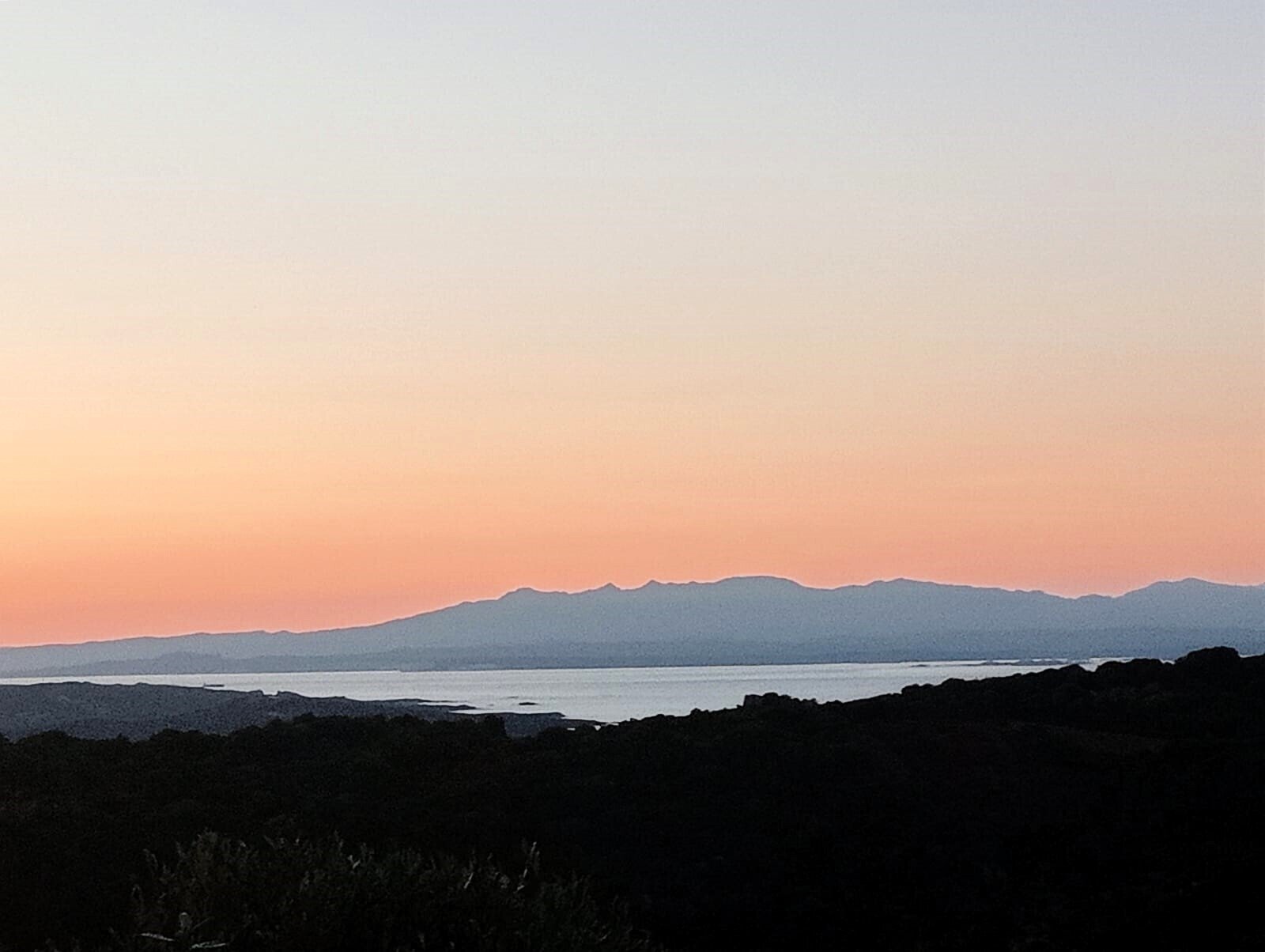 Unobstructed distant view over the lake and mountain range – natural, unspoiled vantage point Unobstructed distant view over the lake and mountain range – natural, unspoiled vantage point