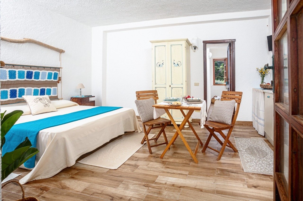 Spacious bedroom with separate living area and built-in wardrobes Spacious bedroom with separate living area and built-in wardrobes