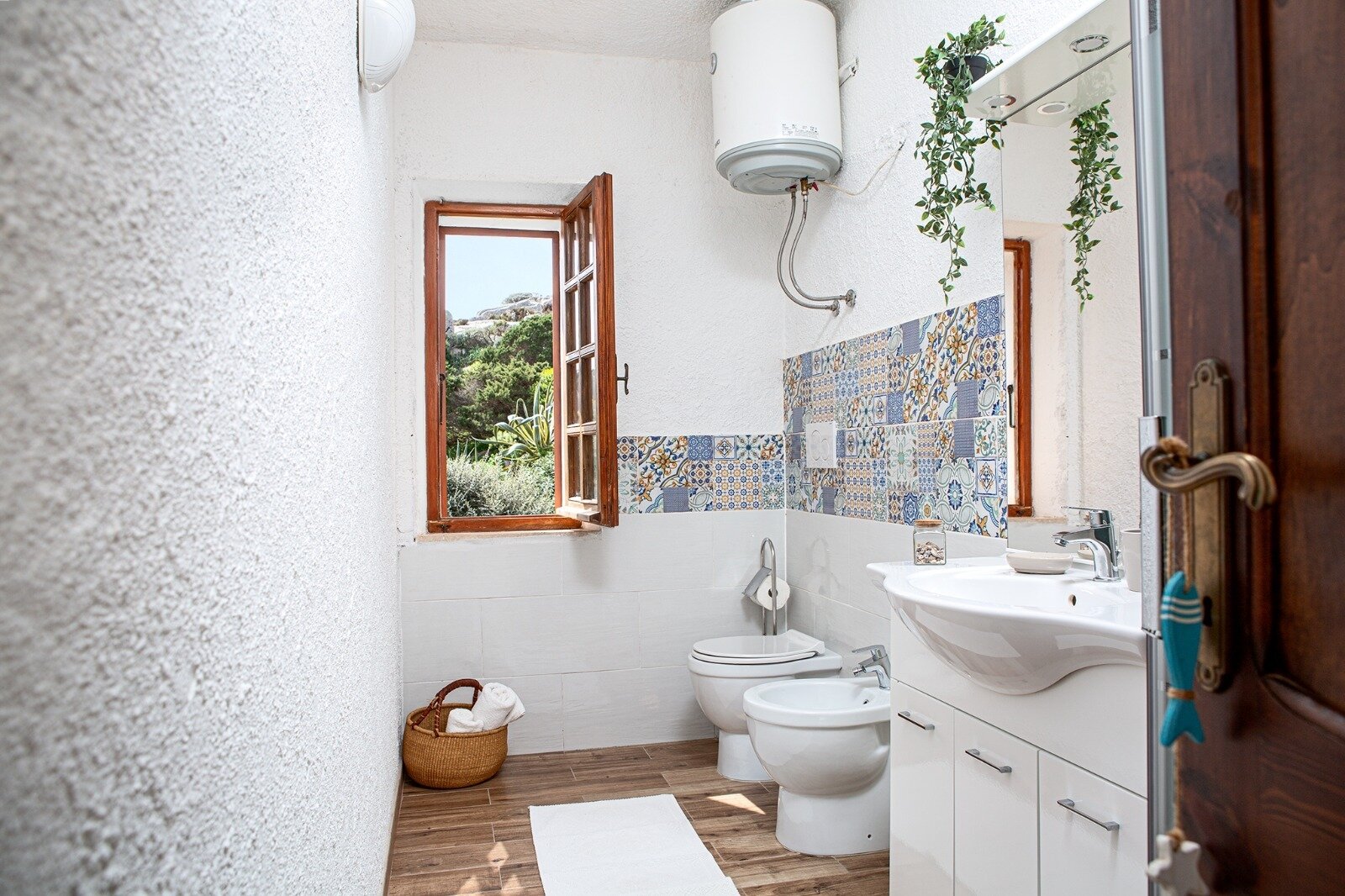 Modern bathroom with window view and high-quality sanitary fittings Modern bathroom with window view and high-quality sanitary fittings